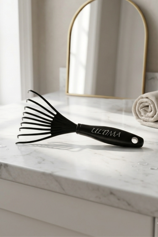 Ultima Brush Cleaner tool for removing hair and product buildup from hair brushes - keeps brushes hygienic.